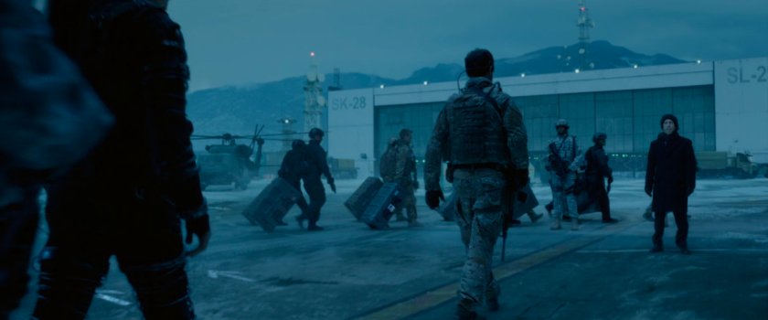 People disembarking a cargo plane at Area 57.
