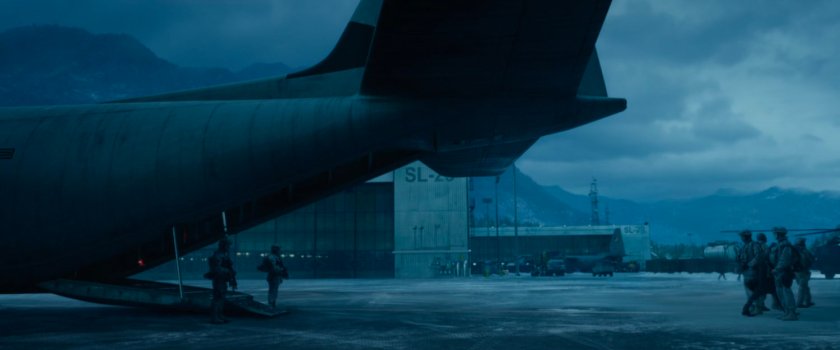 People disembarking a cargo plane at Area 57.