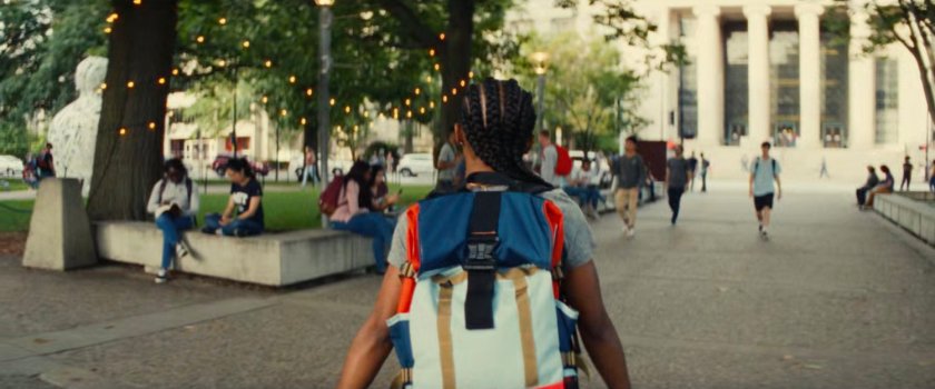Riri walking through MIT quad.