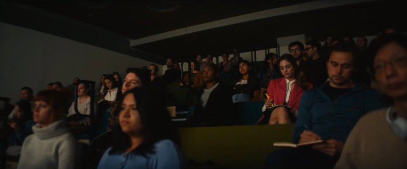 Riri sitting in a crowded MIT classroom.
