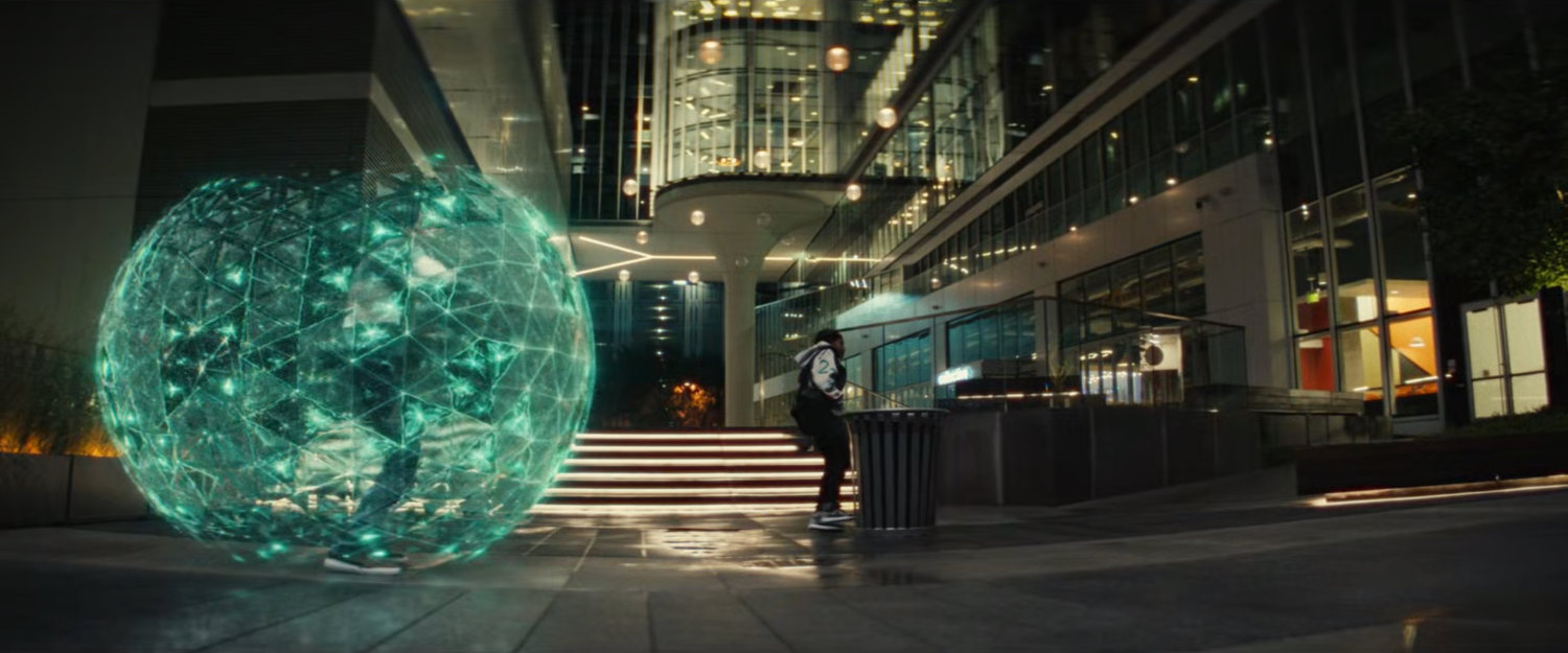 Riri and a student in an energy globe in an MIT quad.