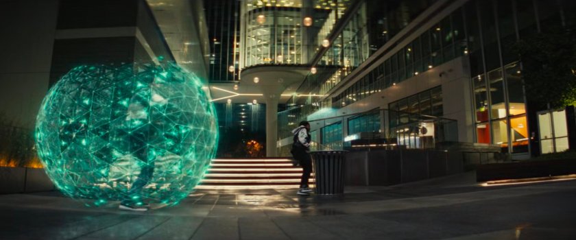 Riri and a student in an energy globe in an MIT quad.