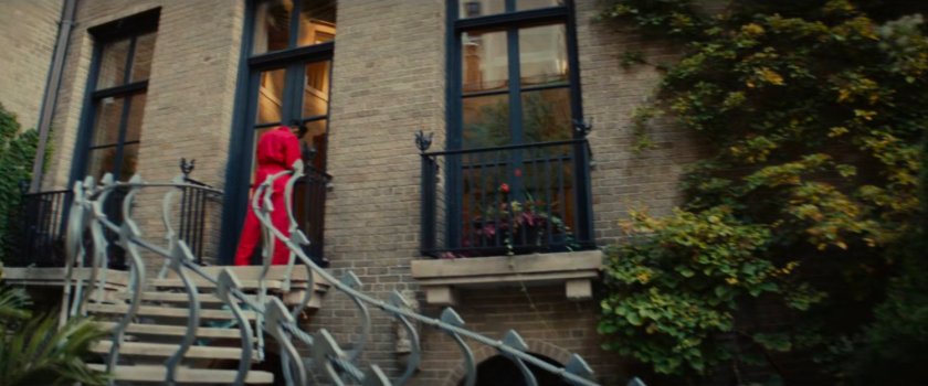 Clown at the back door of a Chicago mansion.