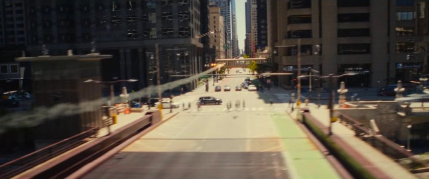 Ironheart flying along Dearborn Street in Chicago.