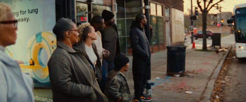 People waiting at a bus stop in Chicago.