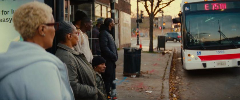 People waiting at a bus stop in Chicago.