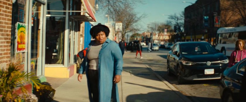 A woman on a sidewalk in Chicago.