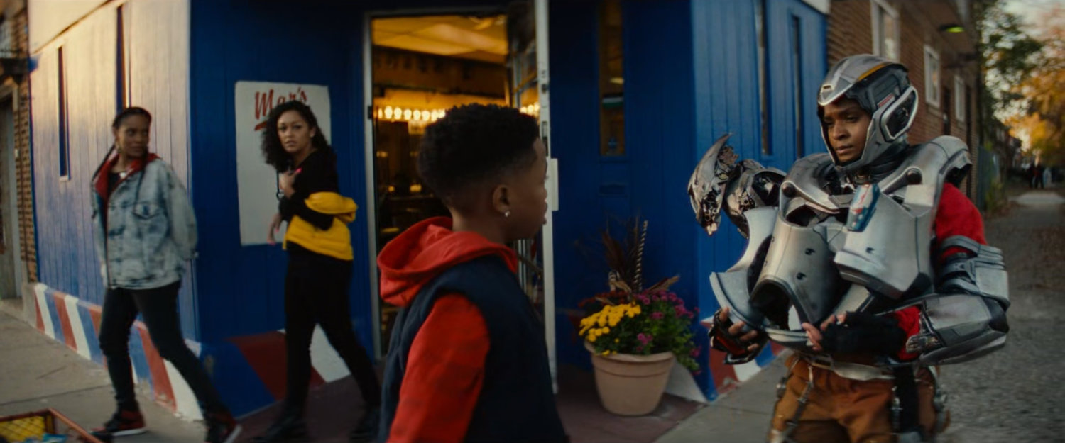 Landon and Riri in front of Mars Barber Shop.