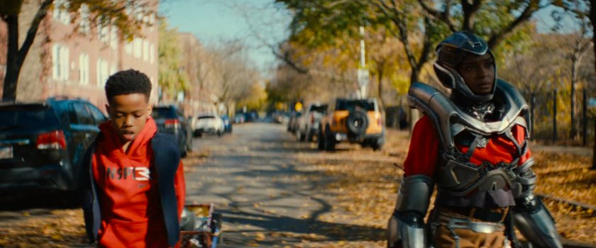 Landon and Riri walking along a street in Chicago.