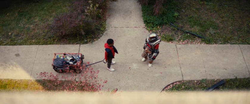 Landon and Riri in front of her apartment building.