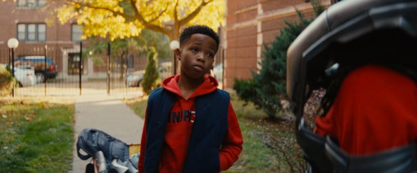 Landon and Riri in front of her apartment building.
