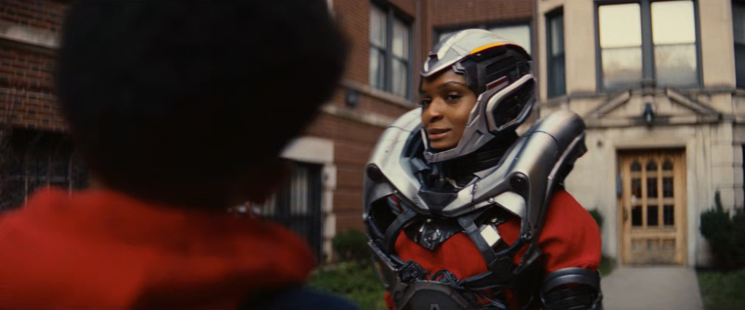 Landon and Riri in front of her apartment building.