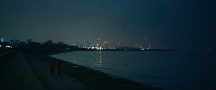 Riri and Xavier walk along the shore of Lake Michigan.