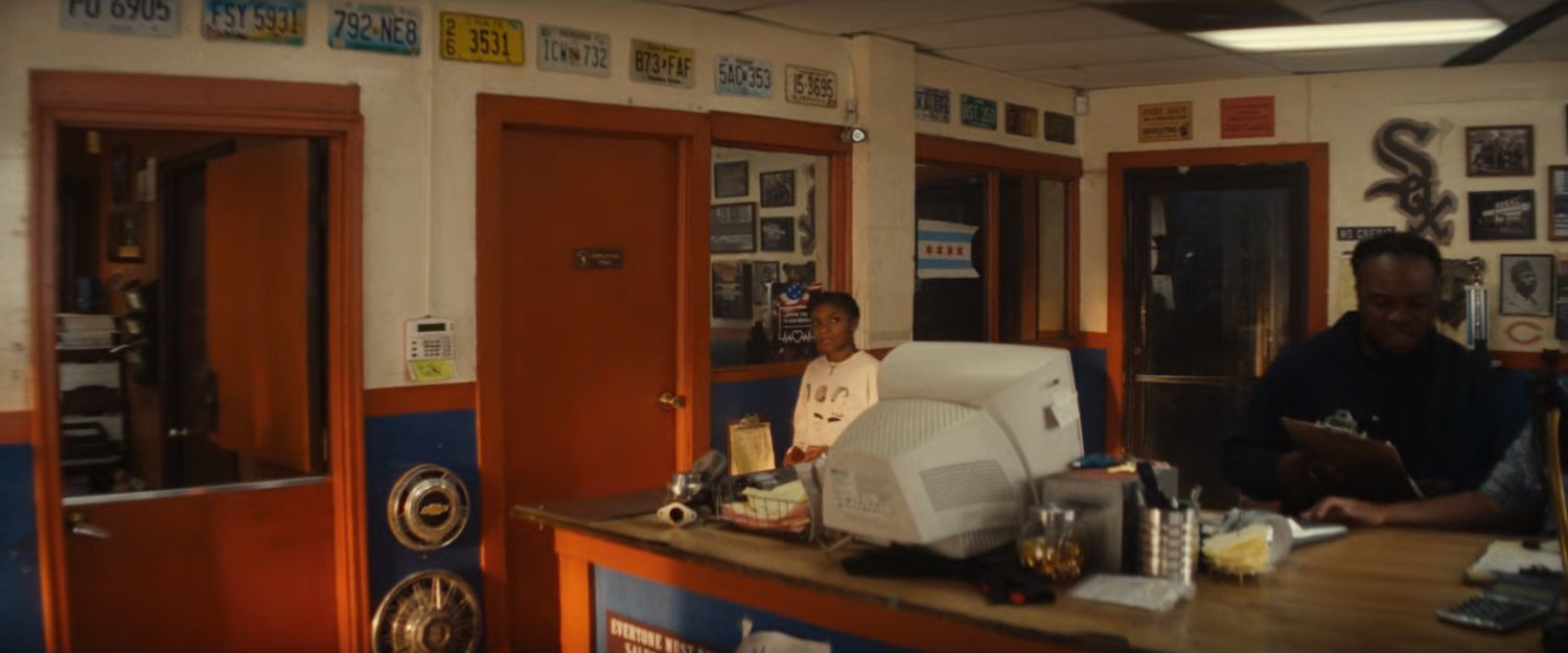 Riri in the front office of Jim's Junkyard.