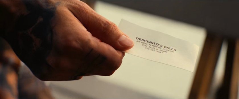 A closeup of a business card for Desperito's Pizza.