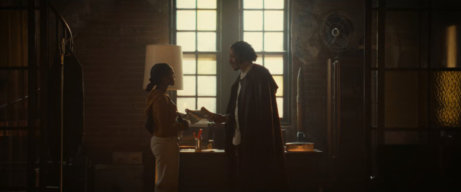 Riri and The Hood in his hideout above Desperito's Pizza.