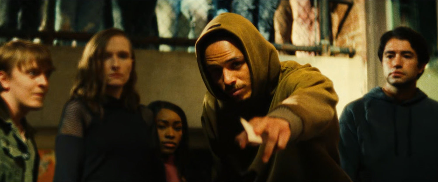 The Hood offering his business card to the Blood siblings.