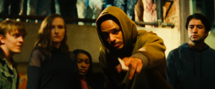 The Hood offering his business card to the Blood siblings.