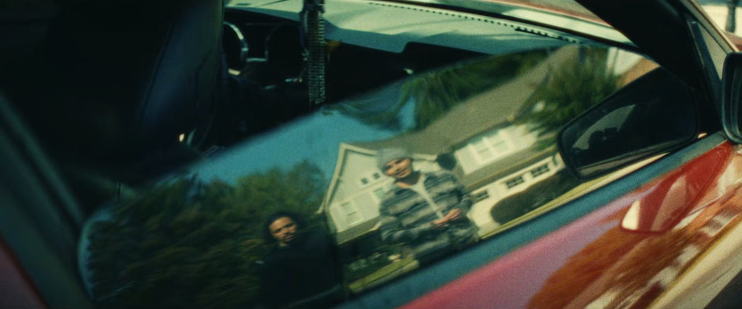 Reflection of The Hood and John approaching Clown.