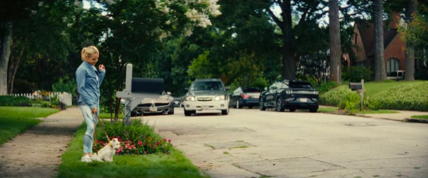 Heather and her dog in front of Joe's house.