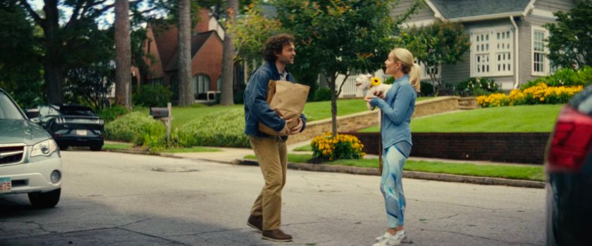 Joe and Heather, with her dog in the street in front of Joe's house.