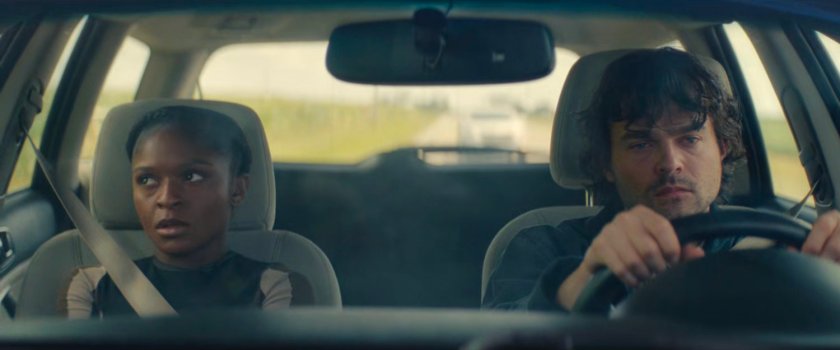 Riri and Joe in his car along an Illinois road.