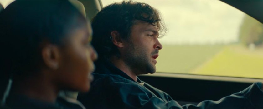 Riri and Joe in his car along an Illinois road.