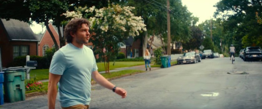 Joe crossing the street outside his house.