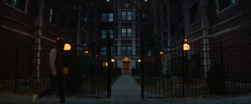 Exterior of Riri's apartment at night.