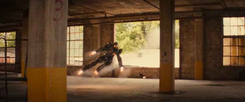 Ironheart flying into a Chicago warehouse.