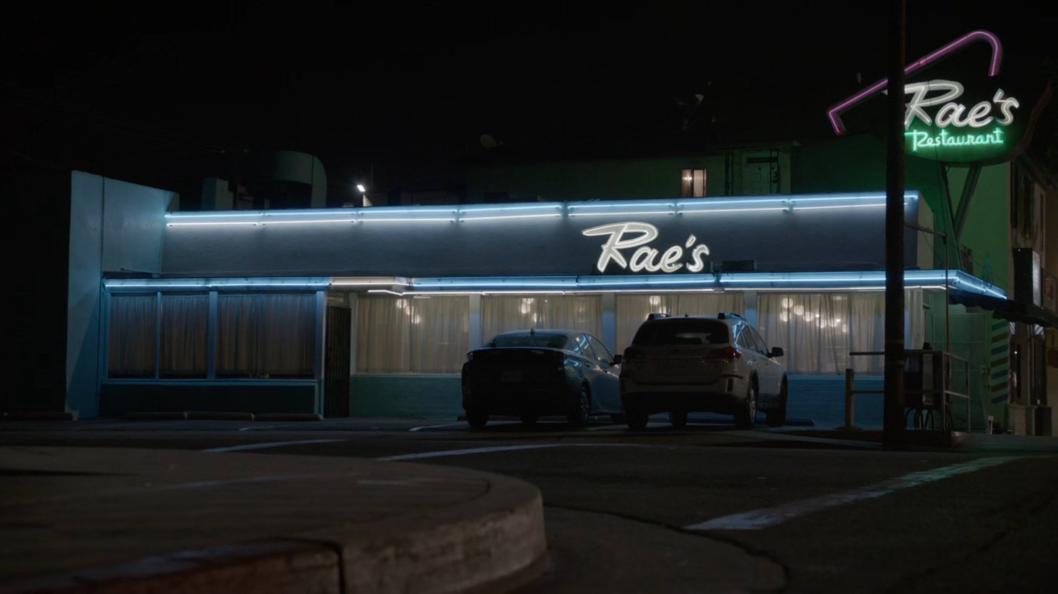 Nighttime exterior of Rae's Restaurant.