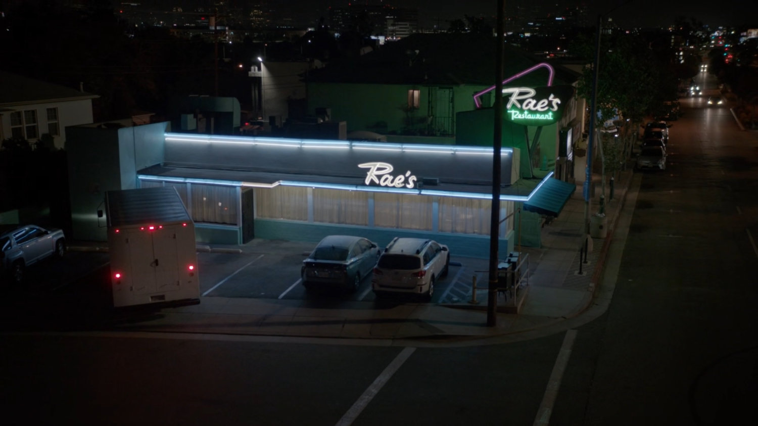 Nighttime exterior of Rae's Restaurant.