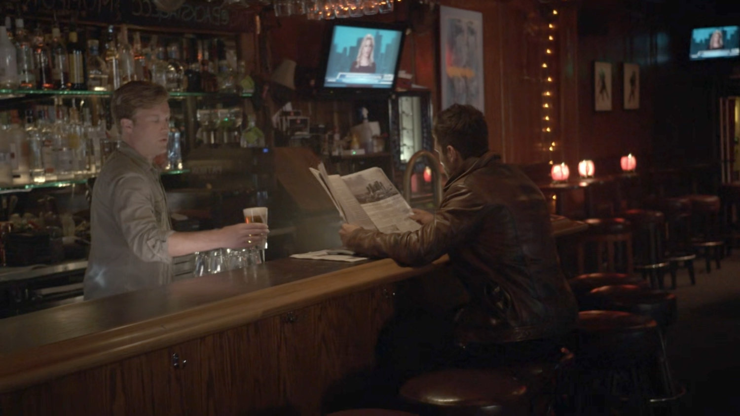 Deke and a bartender in a framework representation of a bar.