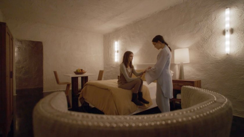 Abby and Simmons in a Kree bedroom on the Lighthouse.