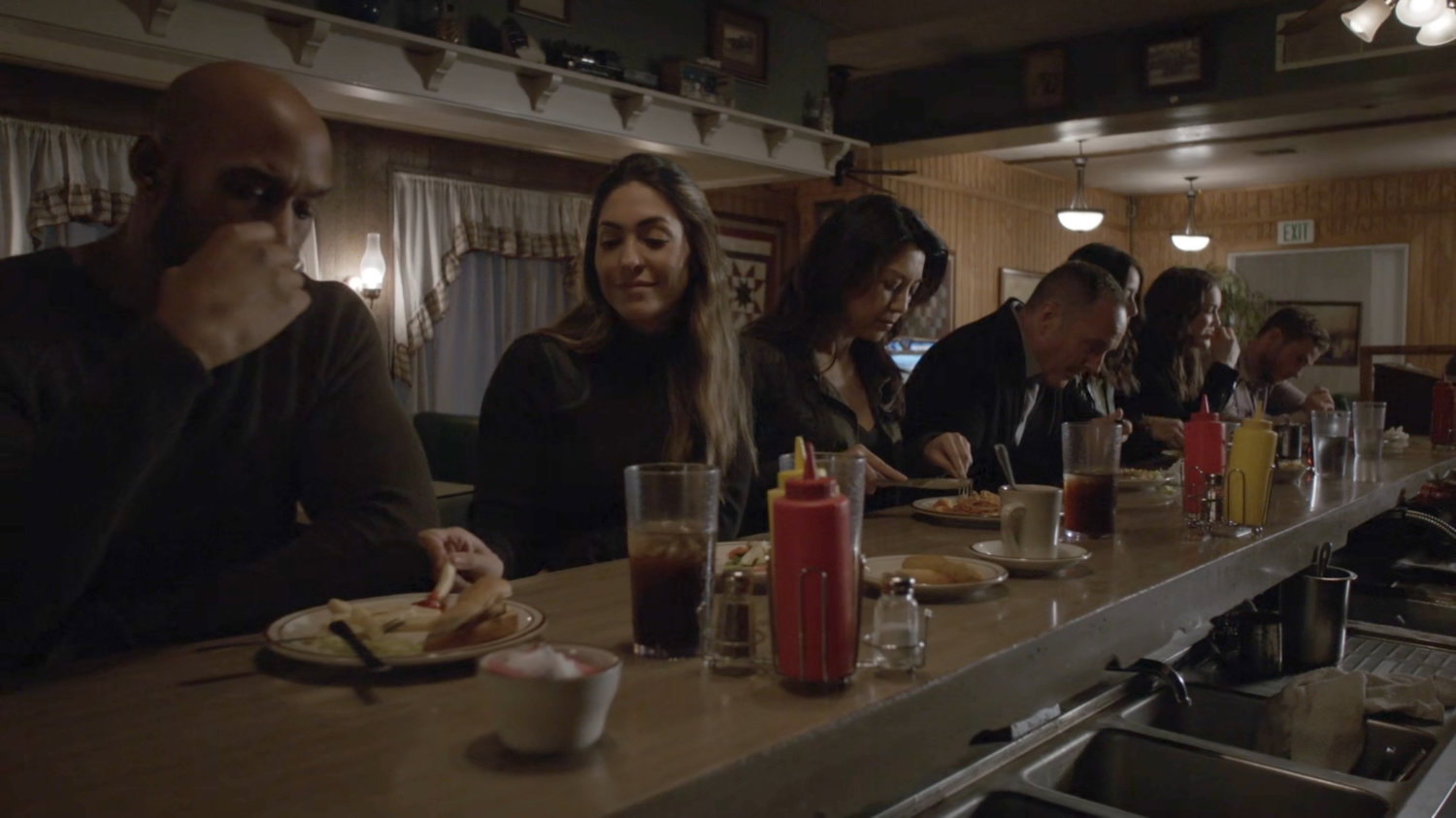 The Agents at a counter in a diner.