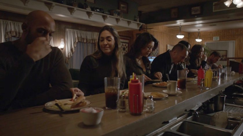 The Agents at a counter in a diner.