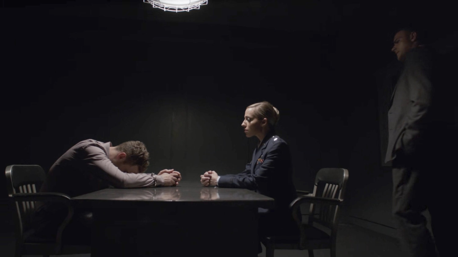 Lt Lucas and Lt Evans interrogate Fitz at a military base.