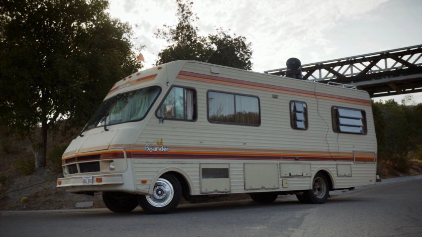 A motor home parked on the side of a road.