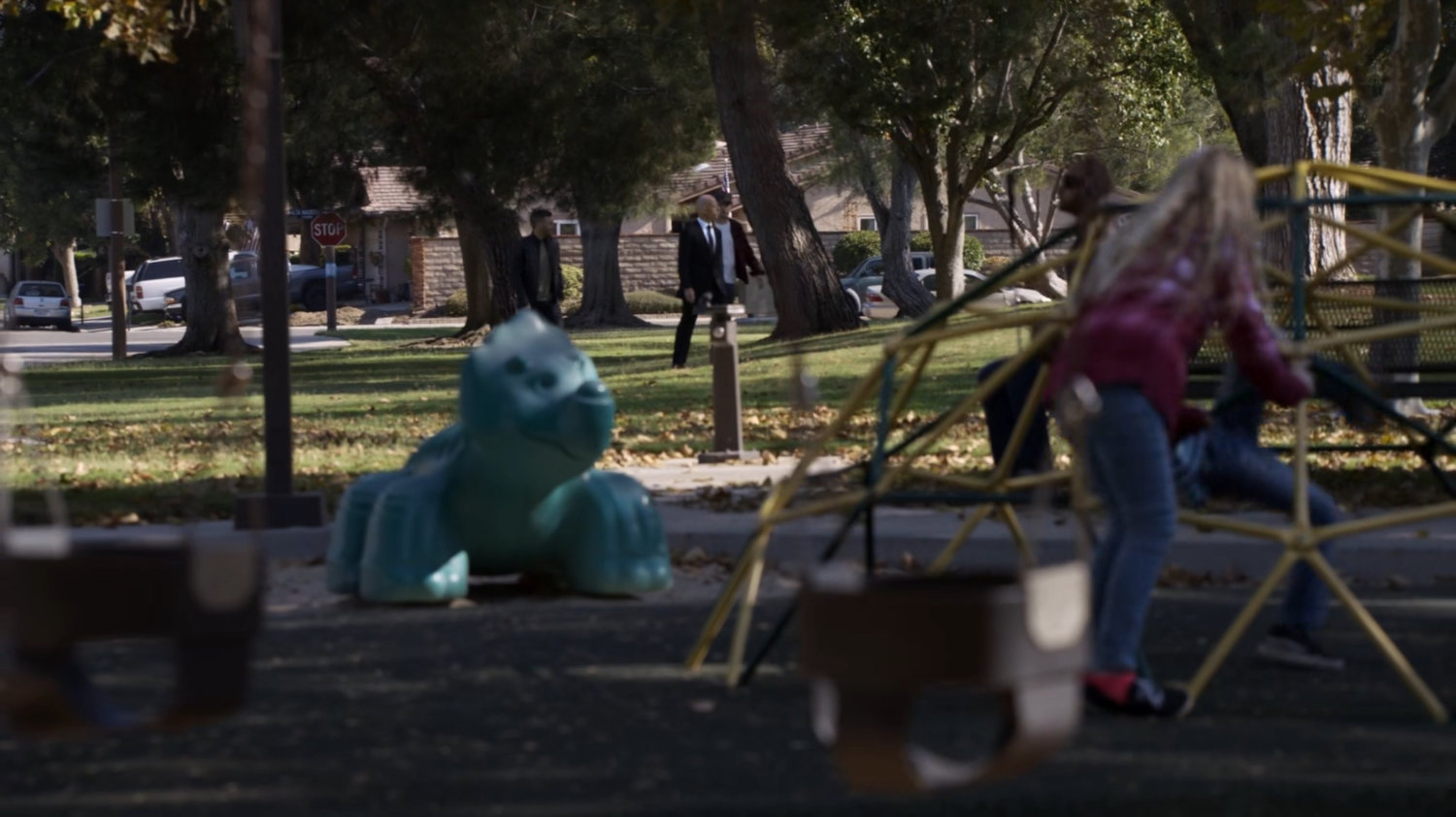 Hunter, Fitz, and Enoch walking through a park.