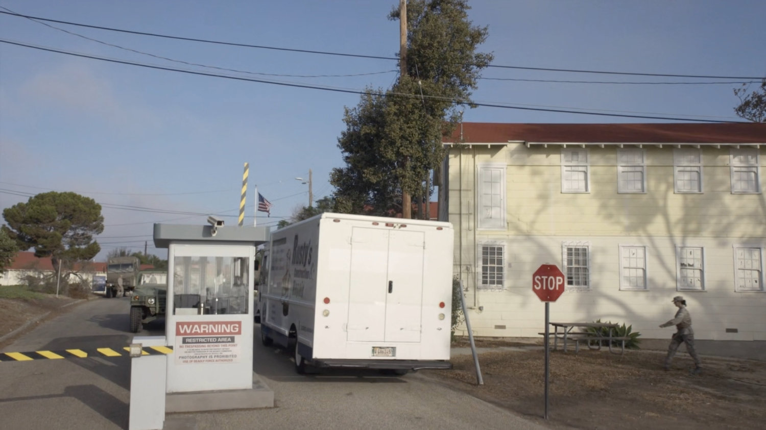 Repair truck entering military base.