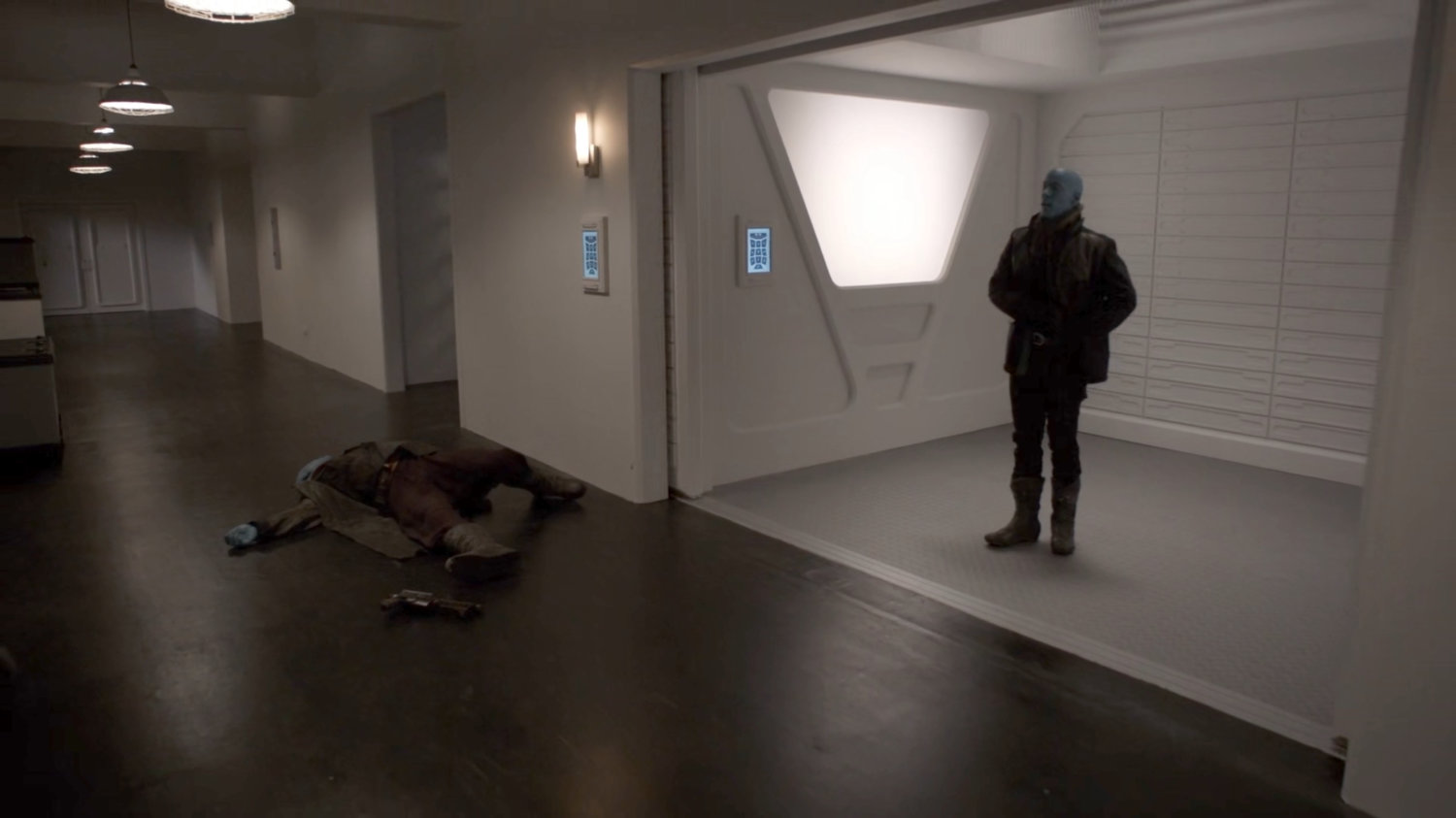 Enoch, disguised as a Kree, boards the elevator to the surface of the Lighthouse.