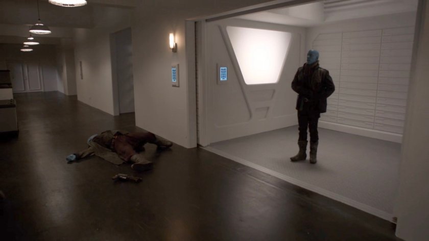 Enoch, disguised as a Kree, boards the elevator to the surface of the Lighthouse.