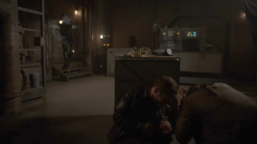 Fitz and Simmons hide from a Kree solider in the power plant of the Lighthouse.