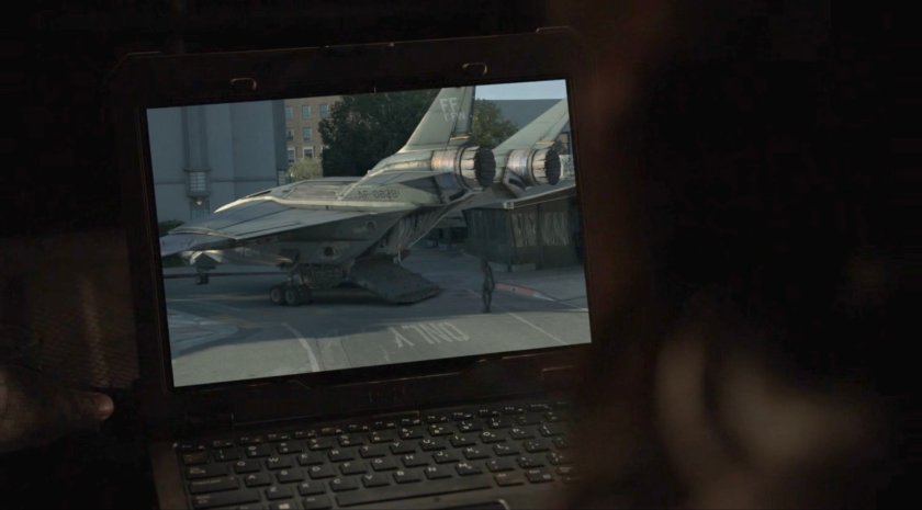 A computer with video image of Daisy walking out of a Quinjet onto a street.
