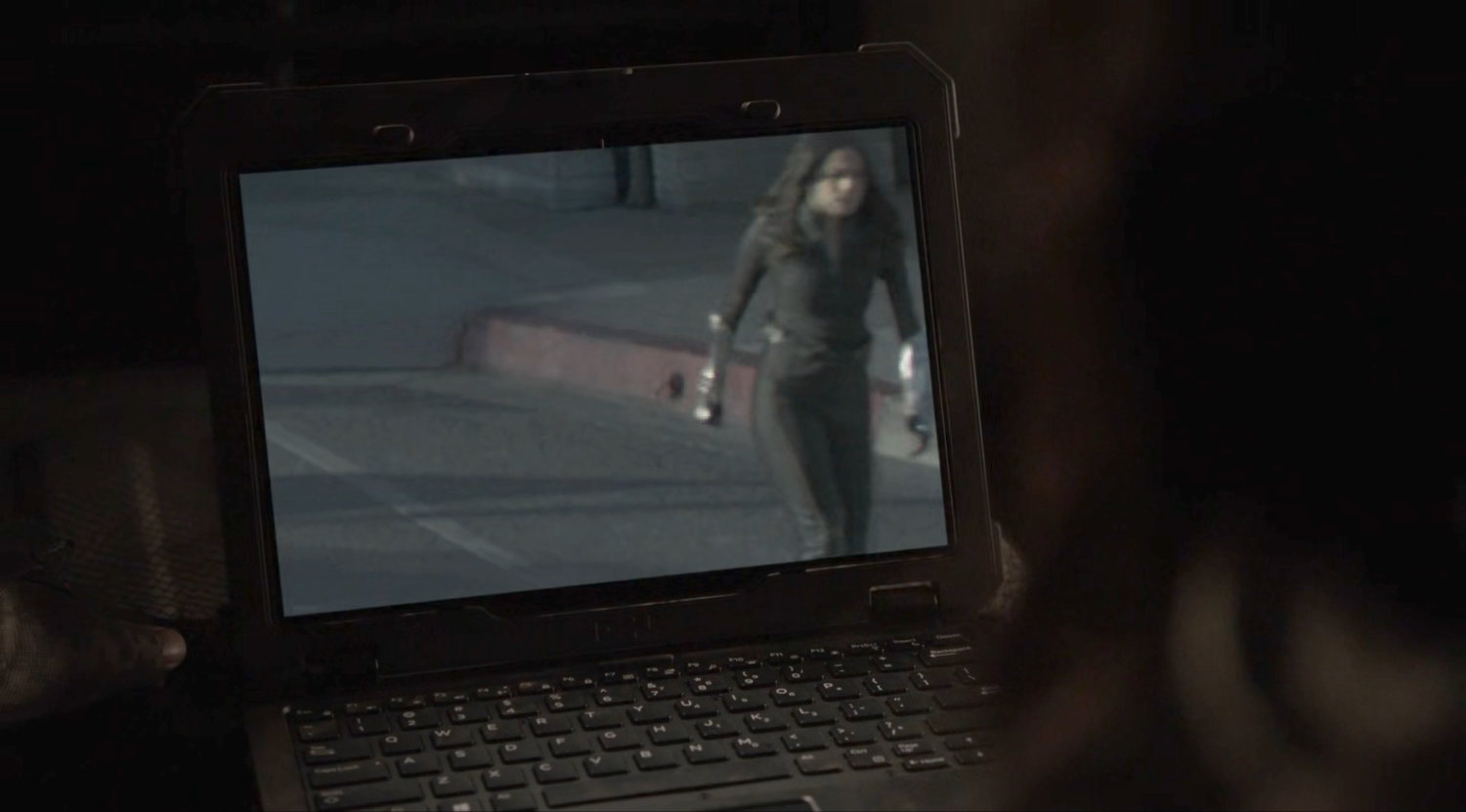 A computer with video image of Daisy walking out of a Quinjet onto a street.