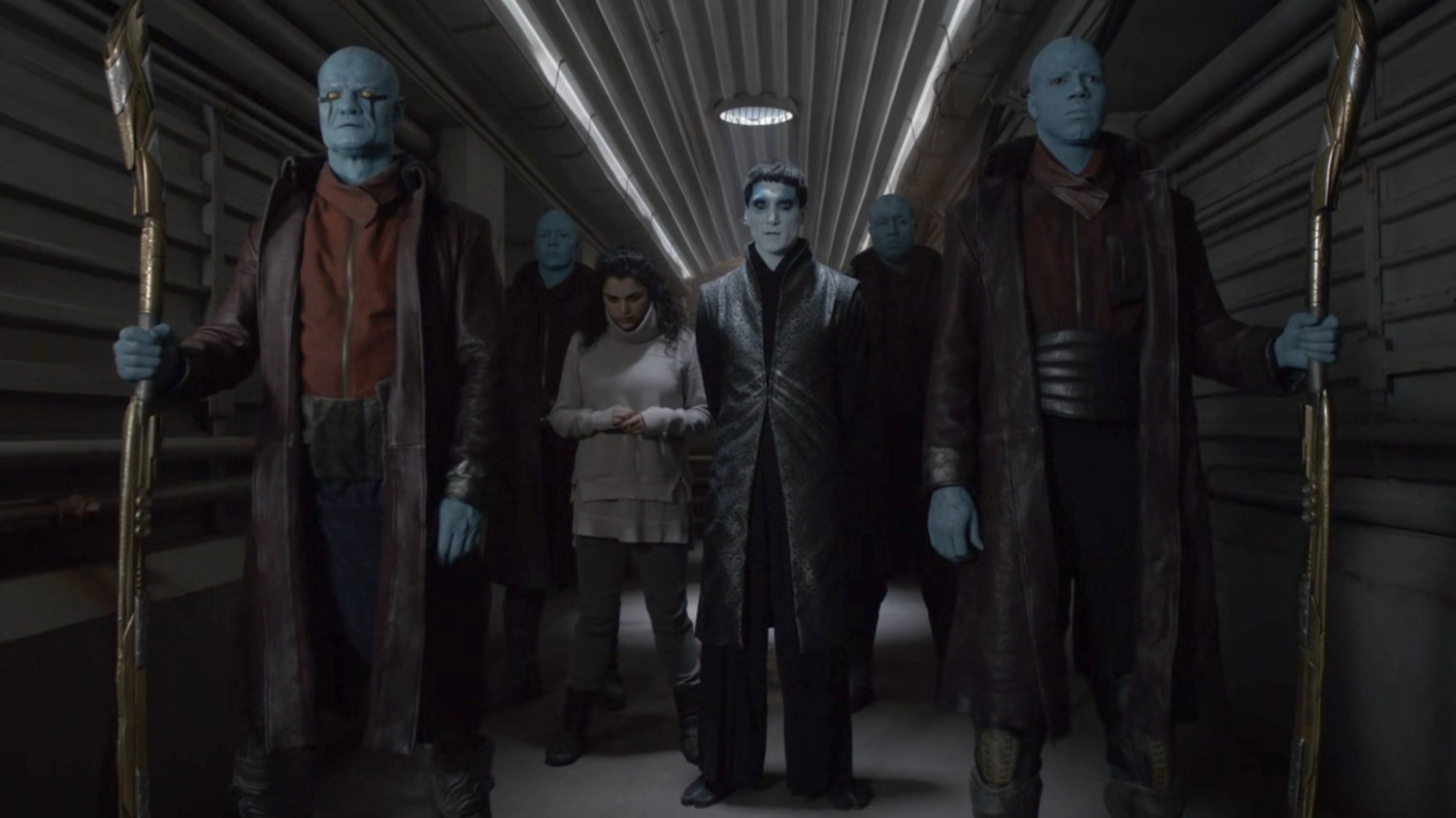 Kasius with Tess and his guards in a hallway of the Lighthouse.
