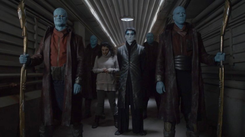 Kasius with Tess and his guards in a hallway of the Lighthouse.