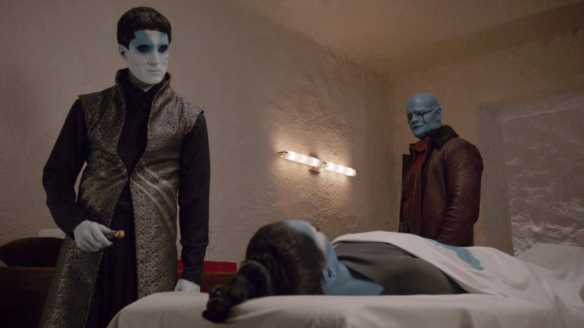 Kasius stands over the dead body of Sinara in the Kree quarters of the Lighthouse.