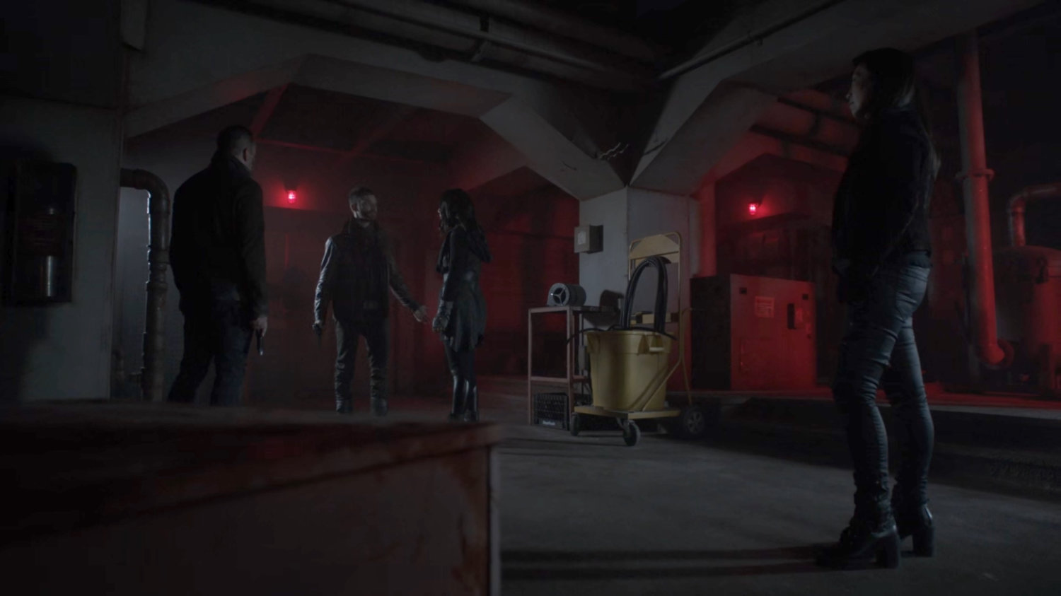 Coulson, Daisy, Deke, and May in a room in the Lighthouse.