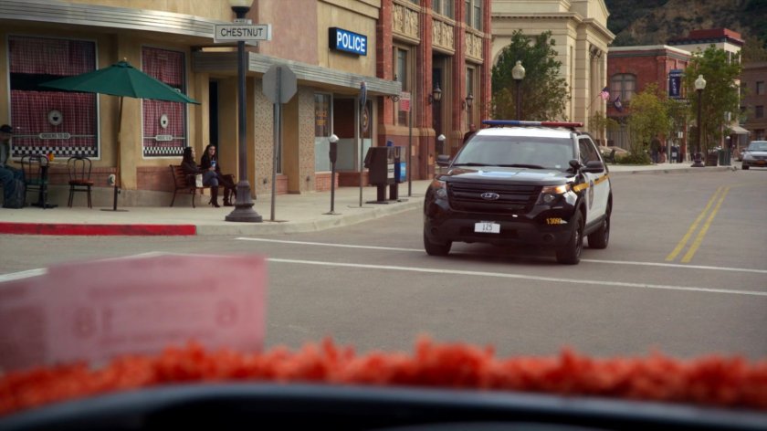 A police SUV in an intersection in River's End.